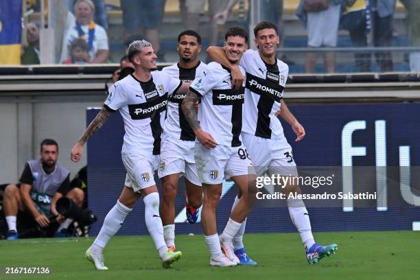 Dennis Man of Parma Calcio celebrates with team mates after scoring the opening goal during the Serie A match between Parma Calcio and Fiorentina at...