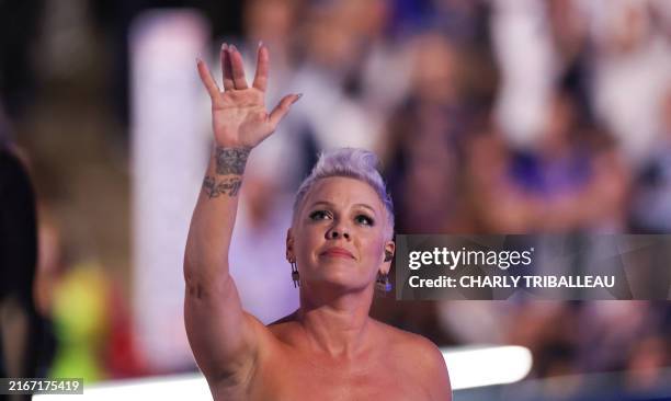 Singer-songwriter Pink leaves the stage after performing her song "What About US" on the fourth and last day of the Democratic National Convention at...