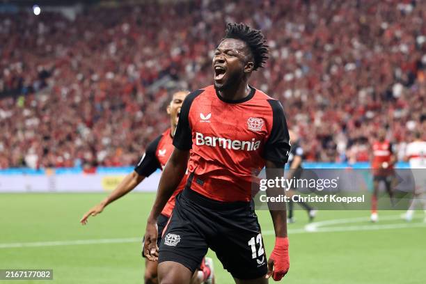 Edmond Tapsoba of Bayer 04 Leverkusen celebrates after teammate Victor Boniface scores his team's first goal during the DFL Supercup 2024 match...