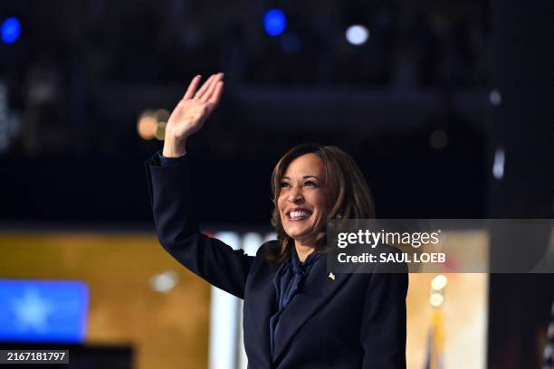 Vice President and 2024 Democratic presidential candidate Kamala Harris waves after speaking on the fourth and last day of the Democratic National...