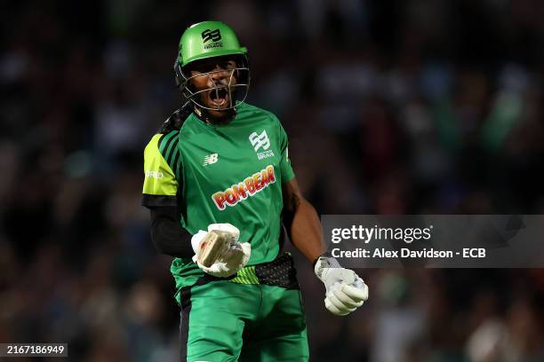 Chris Jordan of Southern Brave celebrates hitting the winning runs in the super set during The Hundred Eliminator match between Birmingham Phoenix...