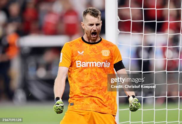 Lukas Hradecky of Bayer 04 Leverkusen celebrates after he saves the third penalty from Frans Kraetzig of VfB Stuttgart in the penalty shoot out...
