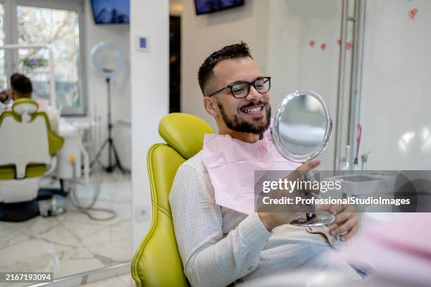patient in dental office - man with one tooth stock pictures, royalty-free photos & images