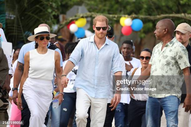 Prince Harry, Duke of Sussex and Meghan, Duchess of Sussex are seen in the streets of San Basilio de Palenque during a visit around Colombia on...