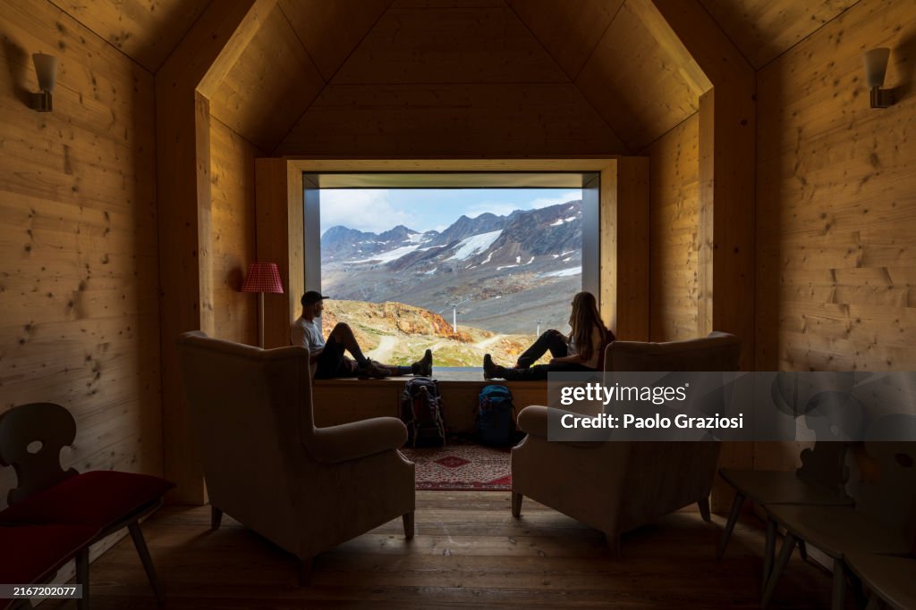 Hikers resting at high altitude in the mountain, Italy