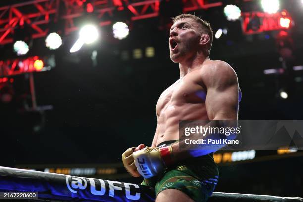 Dricus Du Plessis of South Africa celebrates winning his fight against Israel Adesanya of Nigeria by submission during UFC 305 at RAC Arena on August...