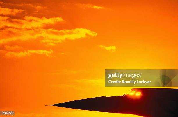 silhouette of the nose of concorde at sunset in england - concorde stock pictures, royalty-free photos & images