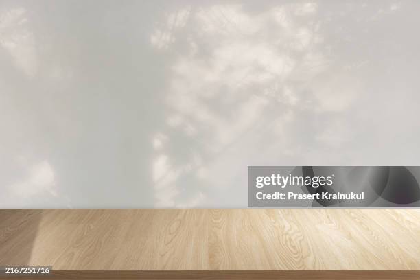 empty wood table with shadow on brick wall - bar table top view stock pictures, royalty-free photos & images