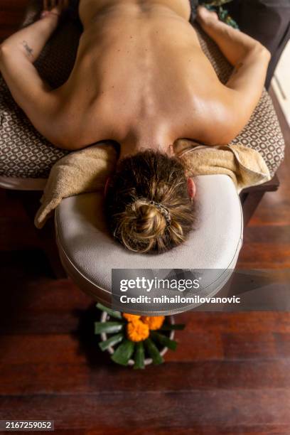 wellness treatment - massage table stock pictures, royalty-free photos & images