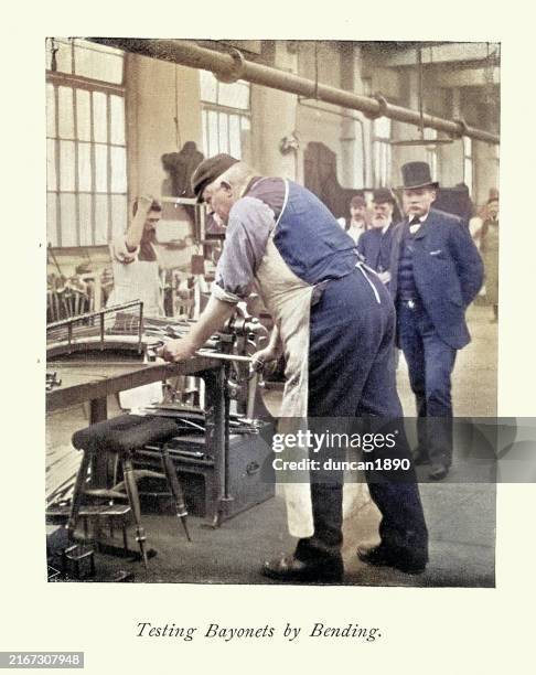 bladesmith testing bayonets by bending, at the royal small arms factory in sparkbrook, birmingham, 1890s, vintage photograph, 19th century - birmingham stock illustrations