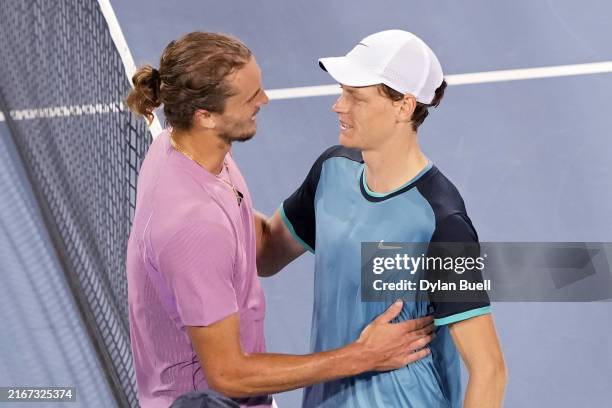 Alexander Zverev of Germany and Jannik Sinner of Italy embrace after Sinner won their match 7-6, 5-7, 7-6 during Day 8 of the Cincinnati Open at the...