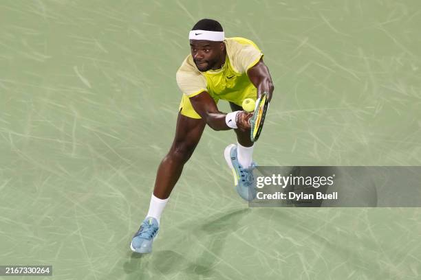 Frances Tiafoe of the United States plays a backhand during his match against Holger Rune of Denmark during Day 8 of the Cincinnati Open at the...