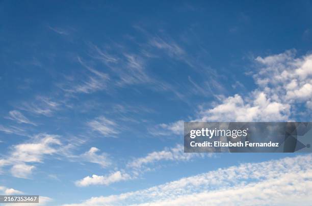 serene blue sky with wispy clouds - wispy cirrus clouds stock pictures, royalty-free photos & images