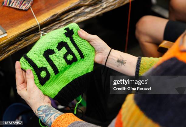 Annette Corsino, owner of the Knitting Tree LA , works on a hat named "Brat" in support of presidential candidate Vice President Kamala Harris at The...