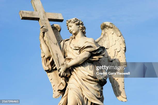 statue on ponte sant' angelo in rome - christian statue stock pictures, royalty-free photos & images