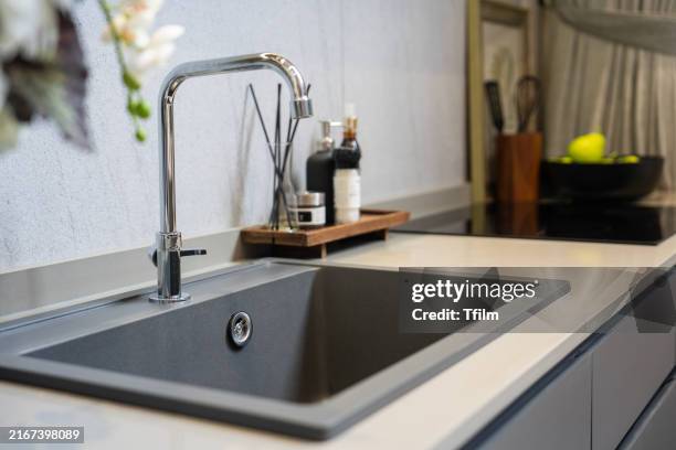 modern kitchen sink with stainless steel faucet - kitchen sink stock pictures, royalty-free photos & images