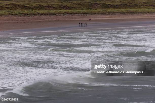 The Inch beach on August 15, 2024 in Inch, Ireland. Inch beach is a stretch of sand and dunes, a popular destination for walkers, swimmers, surfers...