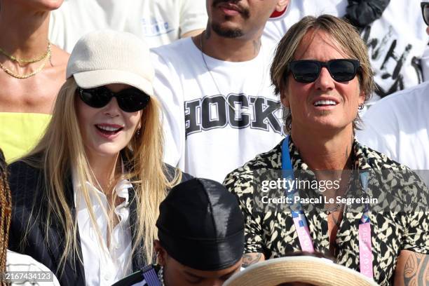 Nicole Kidman, her husband Keith Urban (R attend the Women's Street Final Skateboarkding event on day two of the Olympic Games Paris 2024 at Place de...