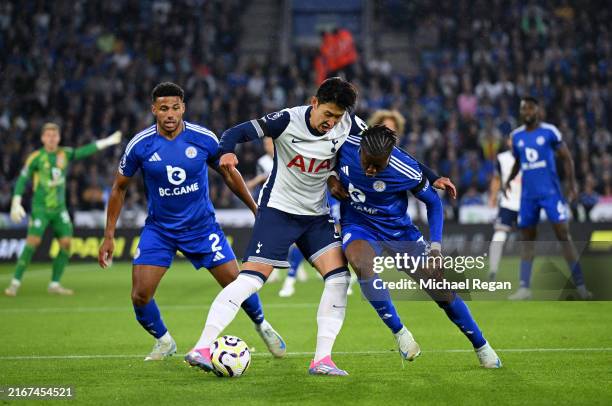 Son Heung-Min of Tottenham Hotspur battles for possession with Abdul Fatawu of Leicester City during the Premier League match between Leicester City...