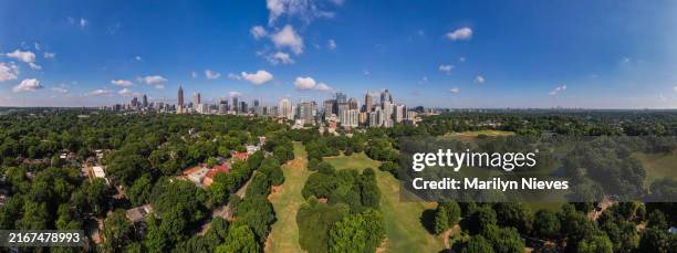 super wide atlanta skyline surrounded by neighborhoods on a beautiful day - atlanta aerial stock pictures, royalty-free photos & images