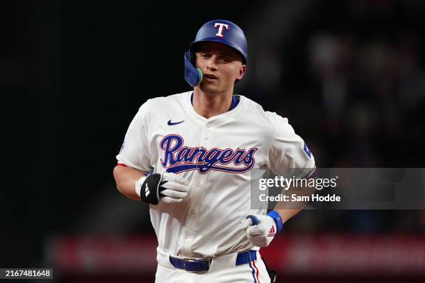 Corey Seager of the Texas Rangers runs the bases after hitting a solo home run during the first inning against the Pittsburgh Pirates at Globe Life...