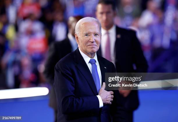 President Joe Biden acknowledges applause after the President's speech during the first day of the Democratic National Convention at the United...