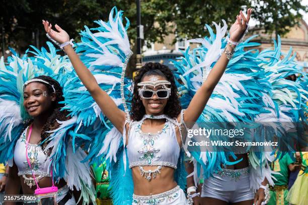 Performers in colourful costumes take part in the Children's Parade of the Notting Hill Carnival in London, United Kingdom on August 25, 2024. Two...