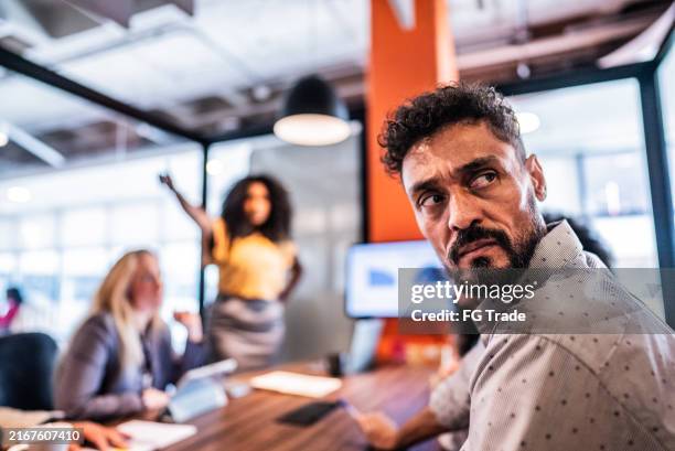 anger mature businessman during meeting at office - mandão imagens e fotografias de stock