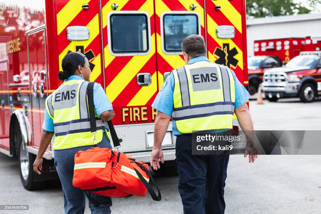 Paramedic and EMT team walking toward rescue ambulance