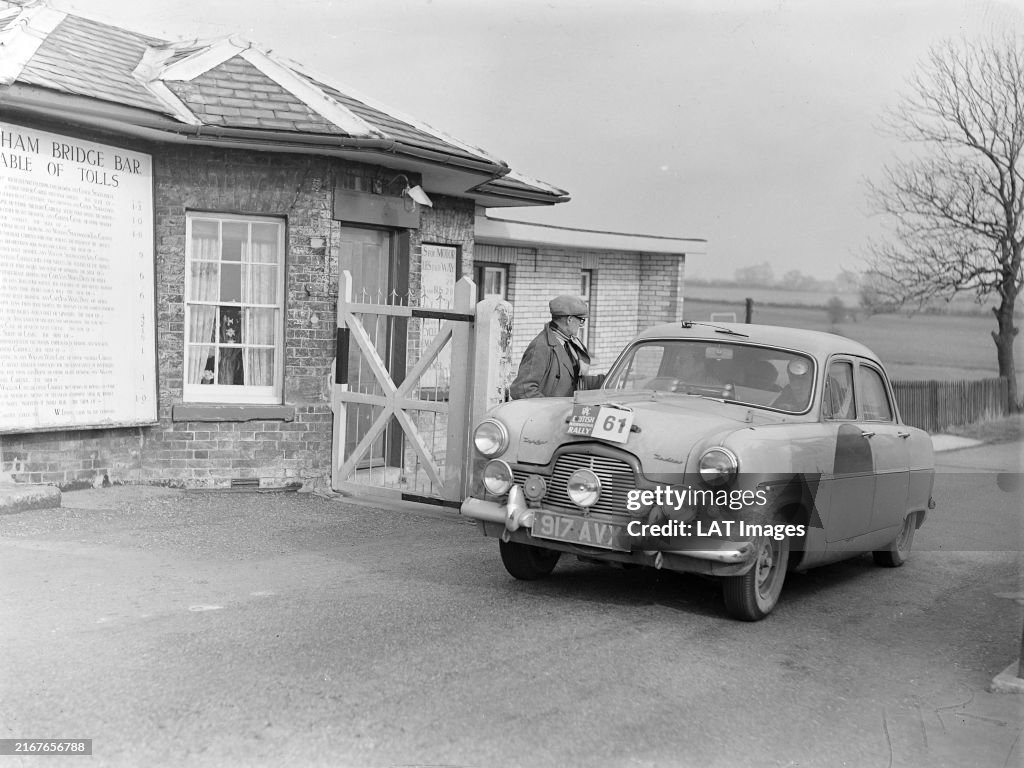 Rac Rally 1960 A Ford Zephyr crew pay their toll during the RAC Rally on March 06 ...