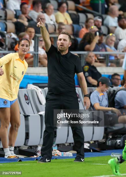Houston Dash head coach Fran Alonso signals to players in the second half during the NWSL match between the Orlando Pride and Houston Dash on August...