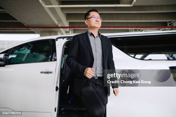 businessman going out from car - airport gate agent stock pictures, royalty-free photos & images