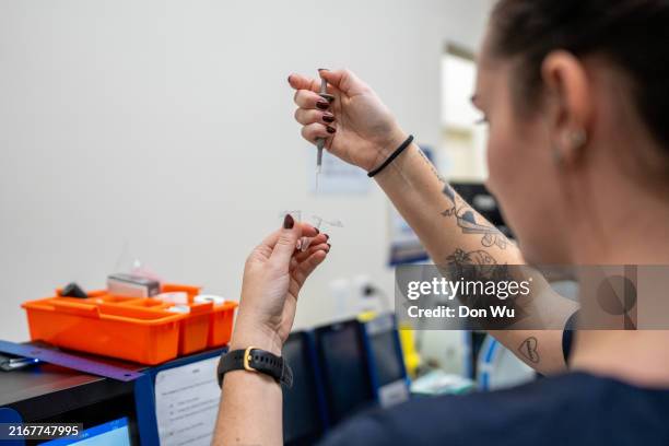 female nurse carrying out medical research - prevention stock pictures, royalty-free photos & images