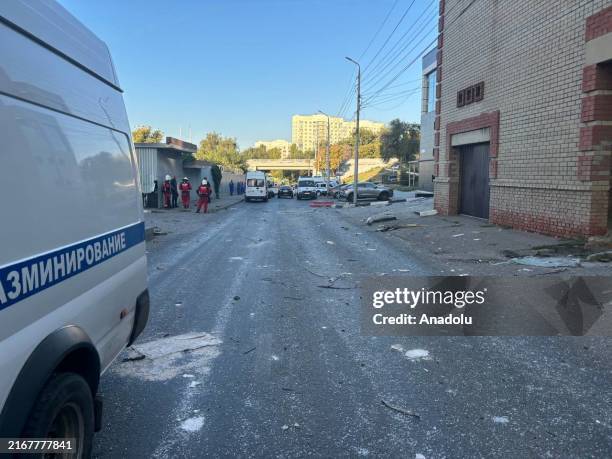 Emergency services arrive to the area after the partially damaged multi-storey building as a result of the drone attack in Predmostovaya Square,...