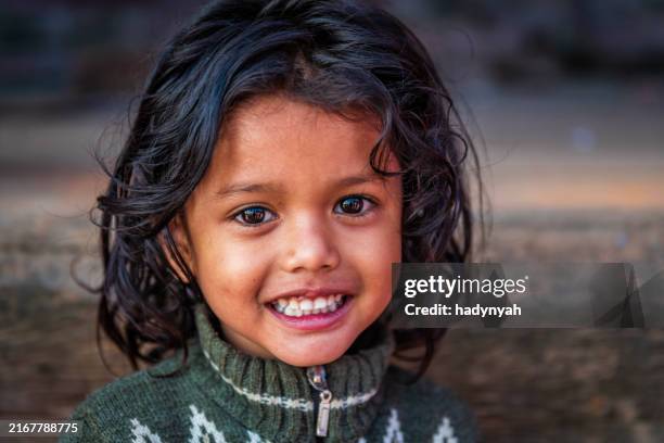portrait of happy little nepali girl in bhaktapur, nepal - nepal child stock pictures, royalty-free photos & images