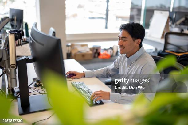 happy make worker photographed in a corporate office - retention stock pictures, royalty-free photos & images