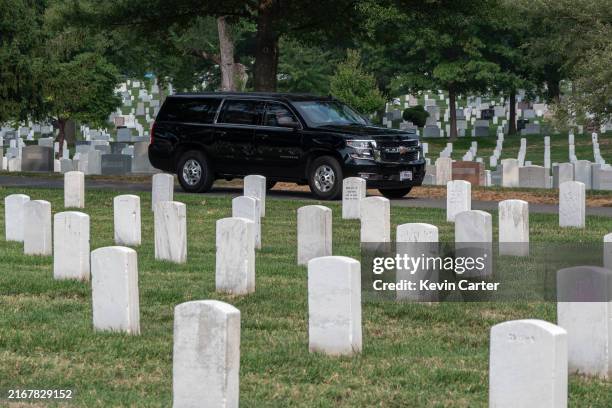 Republican presidential nominee, former U.S. President Donald Trump rides in a SUV through Arlington National Cemetery after a wreath-laying ceremony...