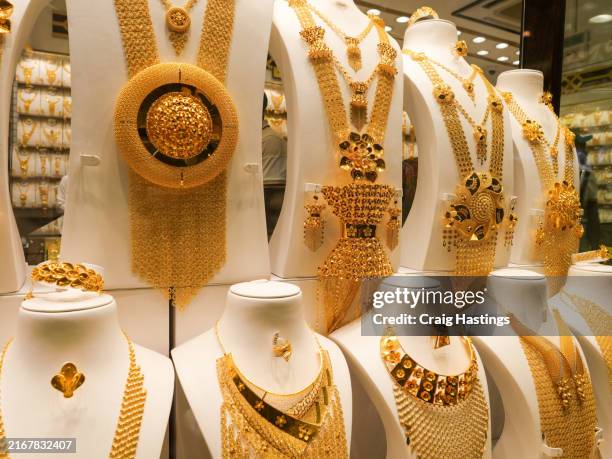 dubai uae - gold and silver souk - traditional body worn arab jewellery for wedding gifts and stores of value - royalty stock pictures, royalty-free photos & images