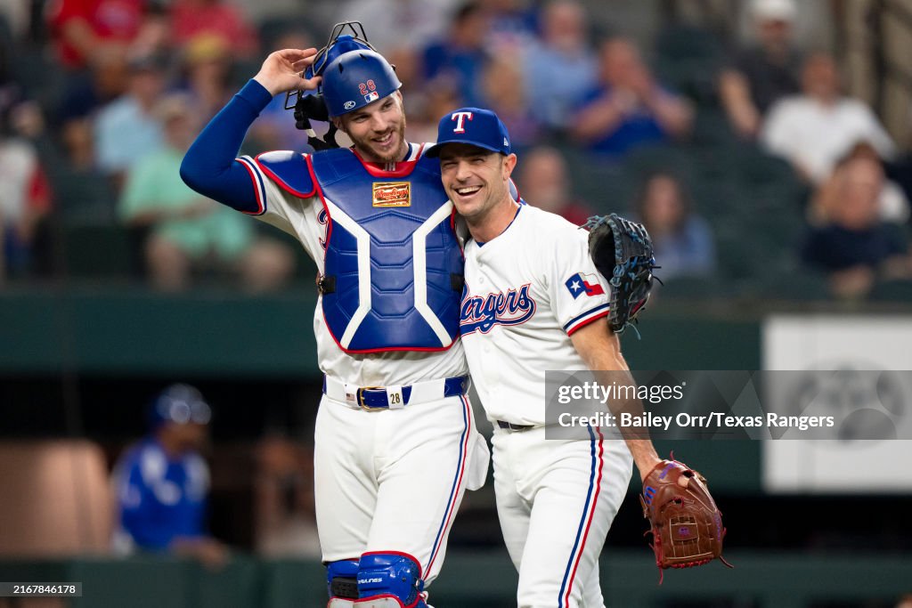 Texas Ranger Heim Jonah Heim and David Robertson of the Texas Rangers smile during a ...
