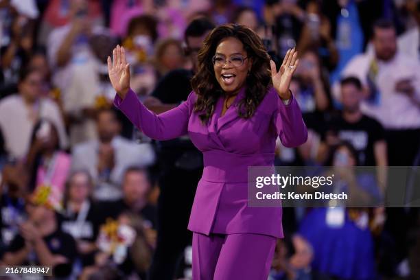 Talk show host Oprah Winfrey arrives to speak on stage during the third day of the Democratic National Convention at the United Center on August 21,...