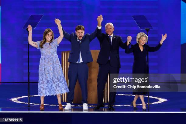 Democratic vice presidential nominee Minnesota Gov. Tim Walz celebrates with his daughter Hope Walz , son Gus Walz and wife Gwen Walz after accepting...