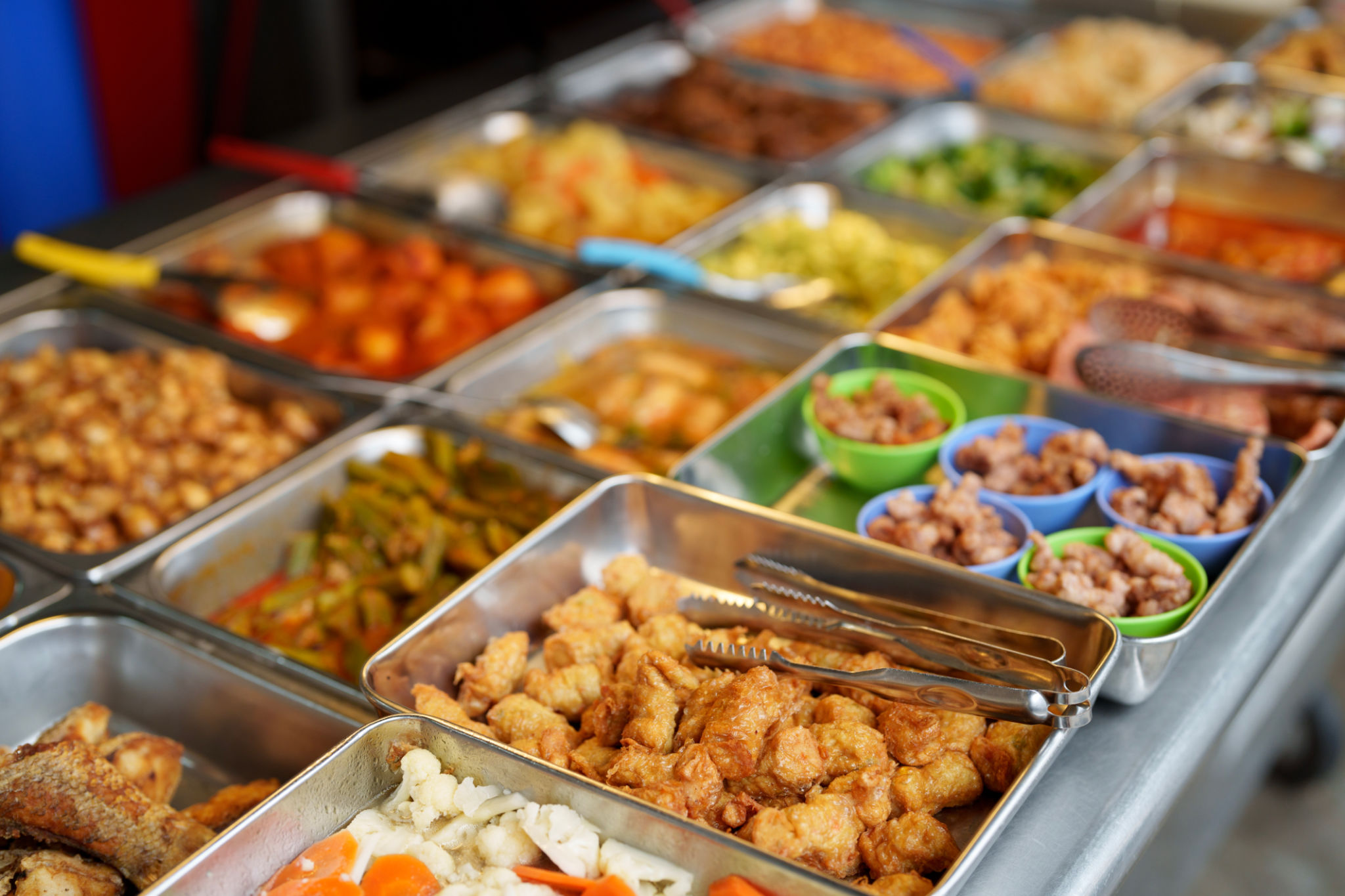 Various choice of food for picking at market stall, known as economy rice in Malaysia Various choice of food for picking at market stall, known as economy rice in Malaysia