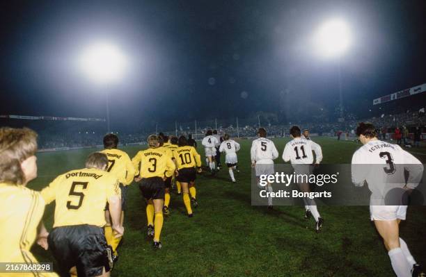 Rear view as the teams emerge ahead of kick-off in the match between Borussia Dortmund and FC St Pauli, at the Westfalenstadion in Dortmund, North...