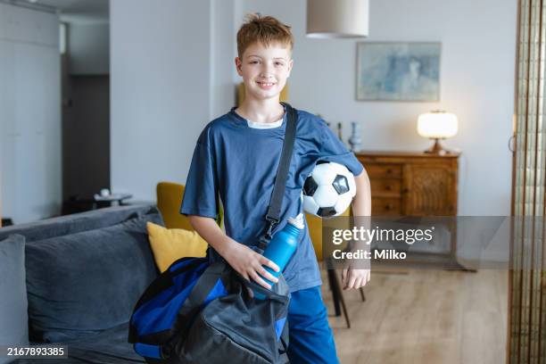smiling teenage boy is ready for sports training - gym bag stock pictures, royalty-free photos & images