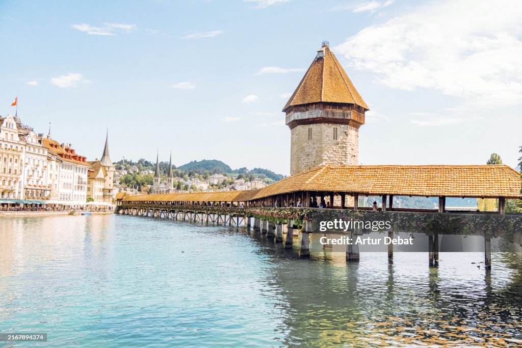 Kapellbrücke medieval bridge in Luzern with city view in Switzerland