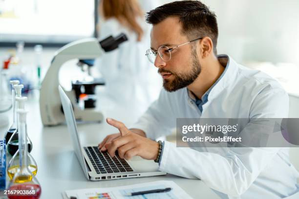 he’s an important part of the scientific lab - scientific research stock pictures, royalty-free photos & images