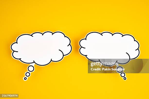 the words talking and speaking are conveyed by a speech bubble with copy space on a yellow background. - tankebubbla bildbanksfoton och bilder