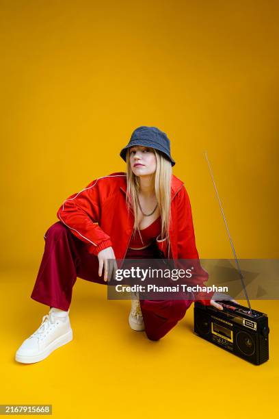 woman wearing 80s hip hop style outfit - crop top model stock pictures, royalty-free photos & images