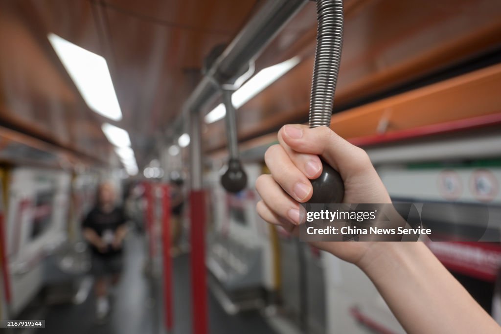 First Mtr Train A ball-shaped straphanger is seen in an MTR Corp's 45th anniversary ...