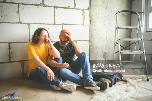 family is renovating a new house ( negative emotions ) - negative emotion stock pictures, royalty-free photos & images
